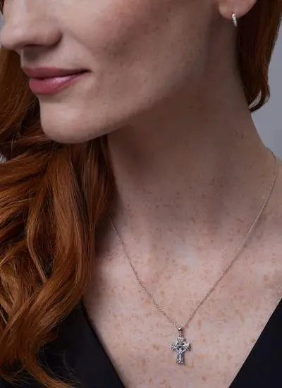 Close up of red haired model wearing Sterling Silver Celtic Trinity Cross With Swarovski Crystals